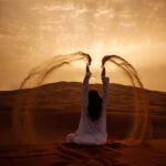 Woman throwing sand