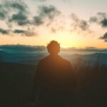 Man watching the sun rise
